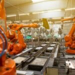 Industrial robotic automation factory representing robotics computing and networking