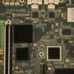 Computer motherboard and expansion hardware illustrating PCIe connectivity