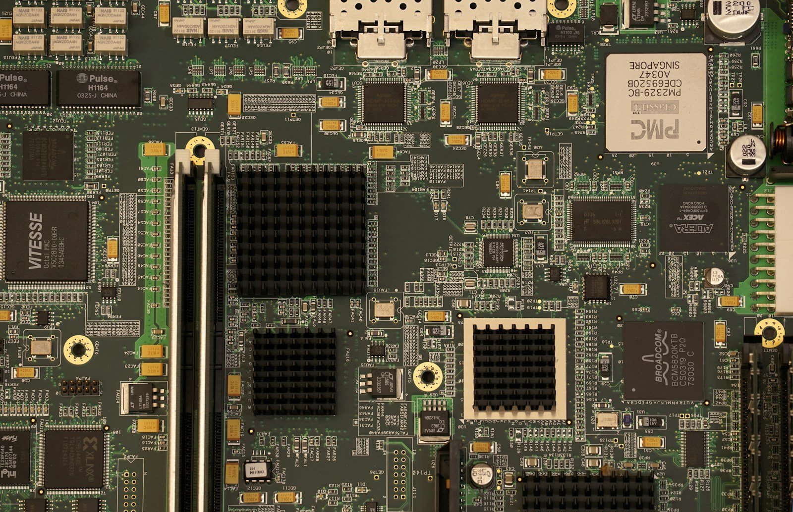 Computer motherboard and expansion hardware illustrating PCIe connectivity
