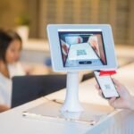 Digital check-in and visitor management screen in a professional setting