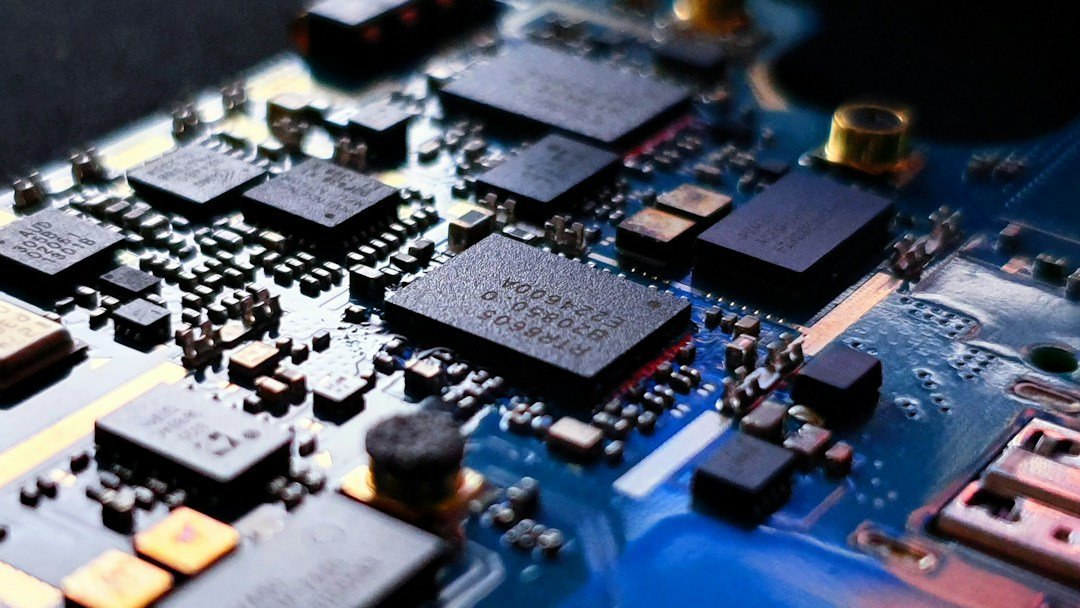 Close-up of a blue printed circuit board with electronic components